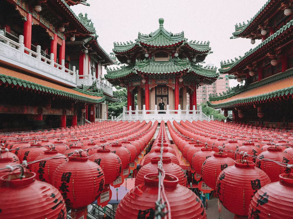 Rows of bright red lanterns filling a Taiwanese temple courtyard